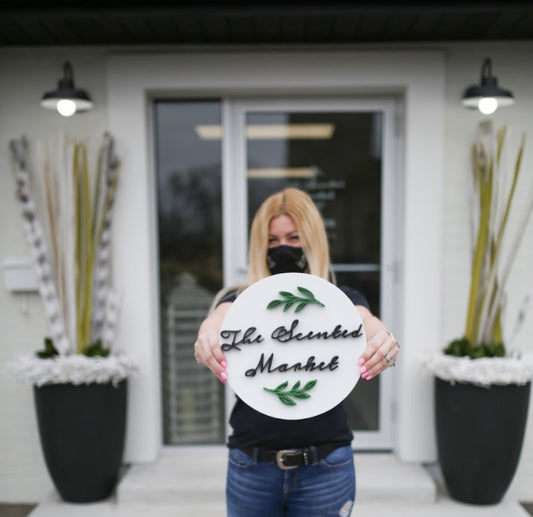 Kristy Miller standing in front of The Scented Market Guelph location