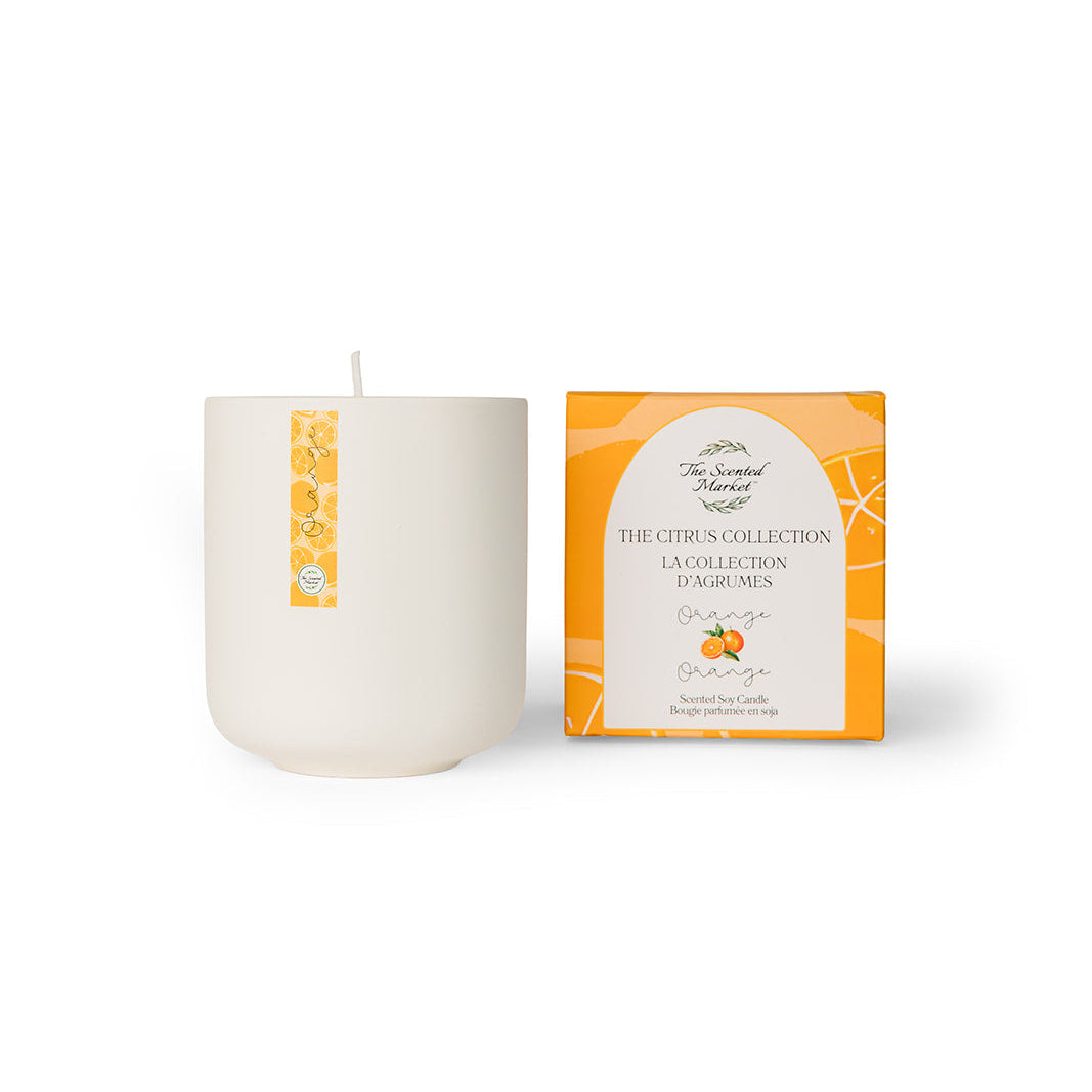 Candle and its packaging on a white background