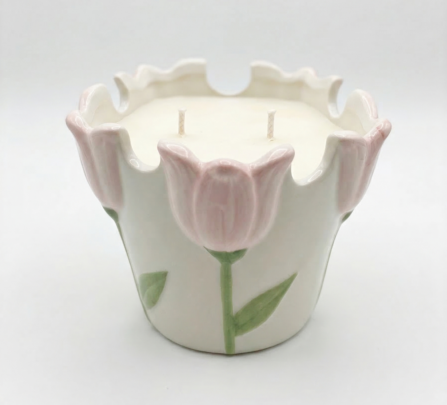 Ceramic tulip-shaped candle with a white background