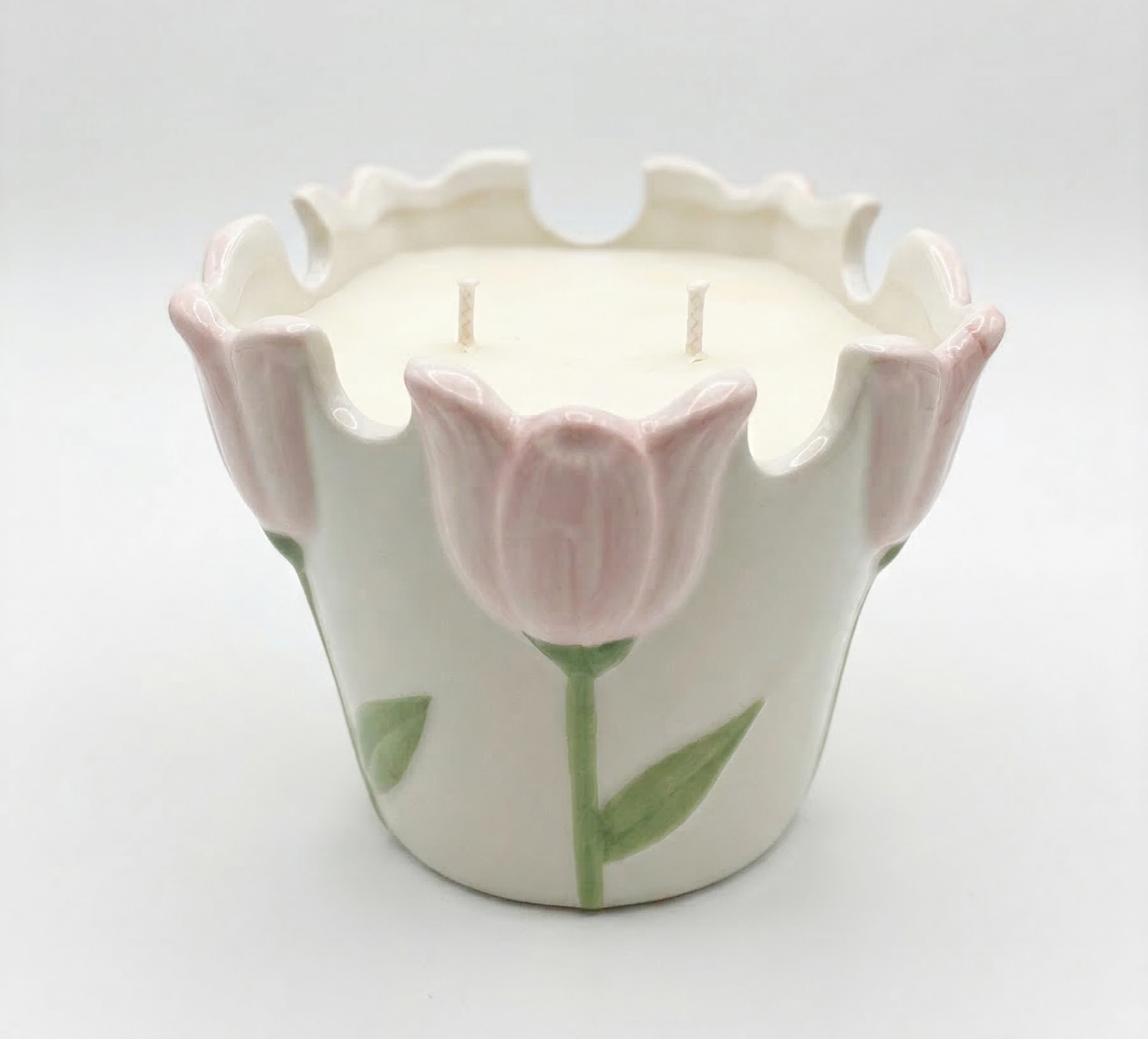 Ceramic tulip-shaped candle with a white background