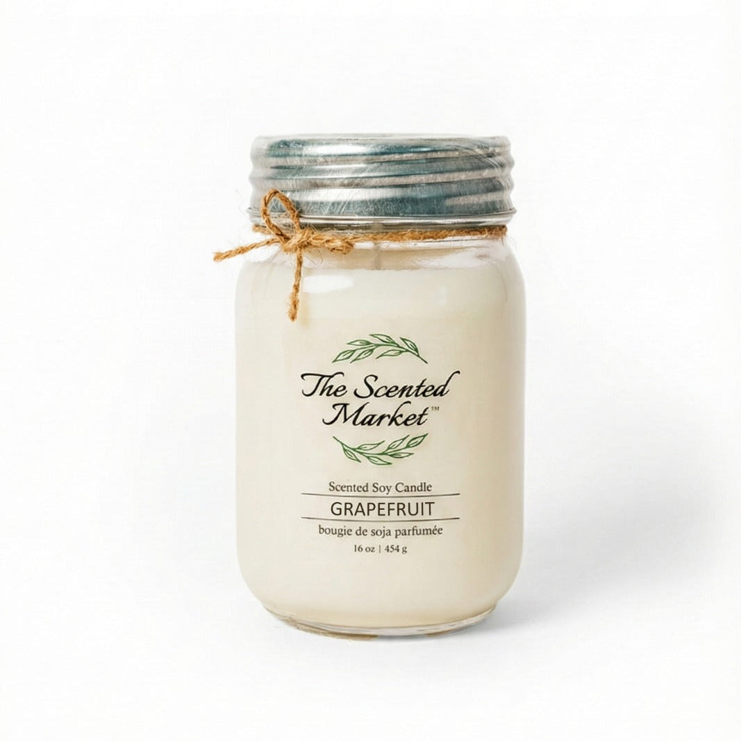 Grapefruit candle in a mason jar with 'The Scented Market' label on a white background