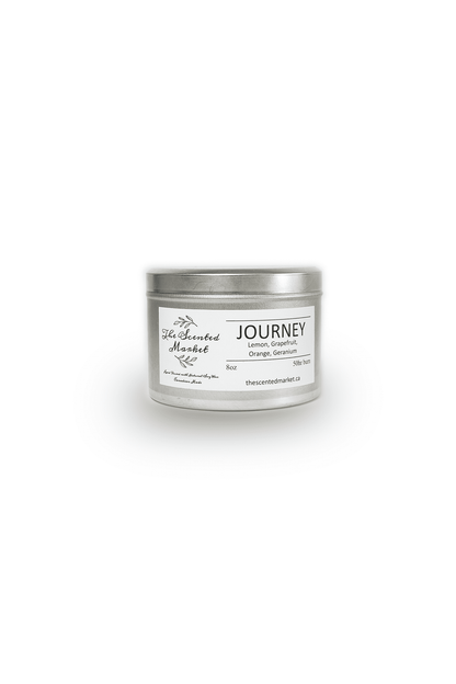 Journey Essential Oil Candle in a silver tin jar.