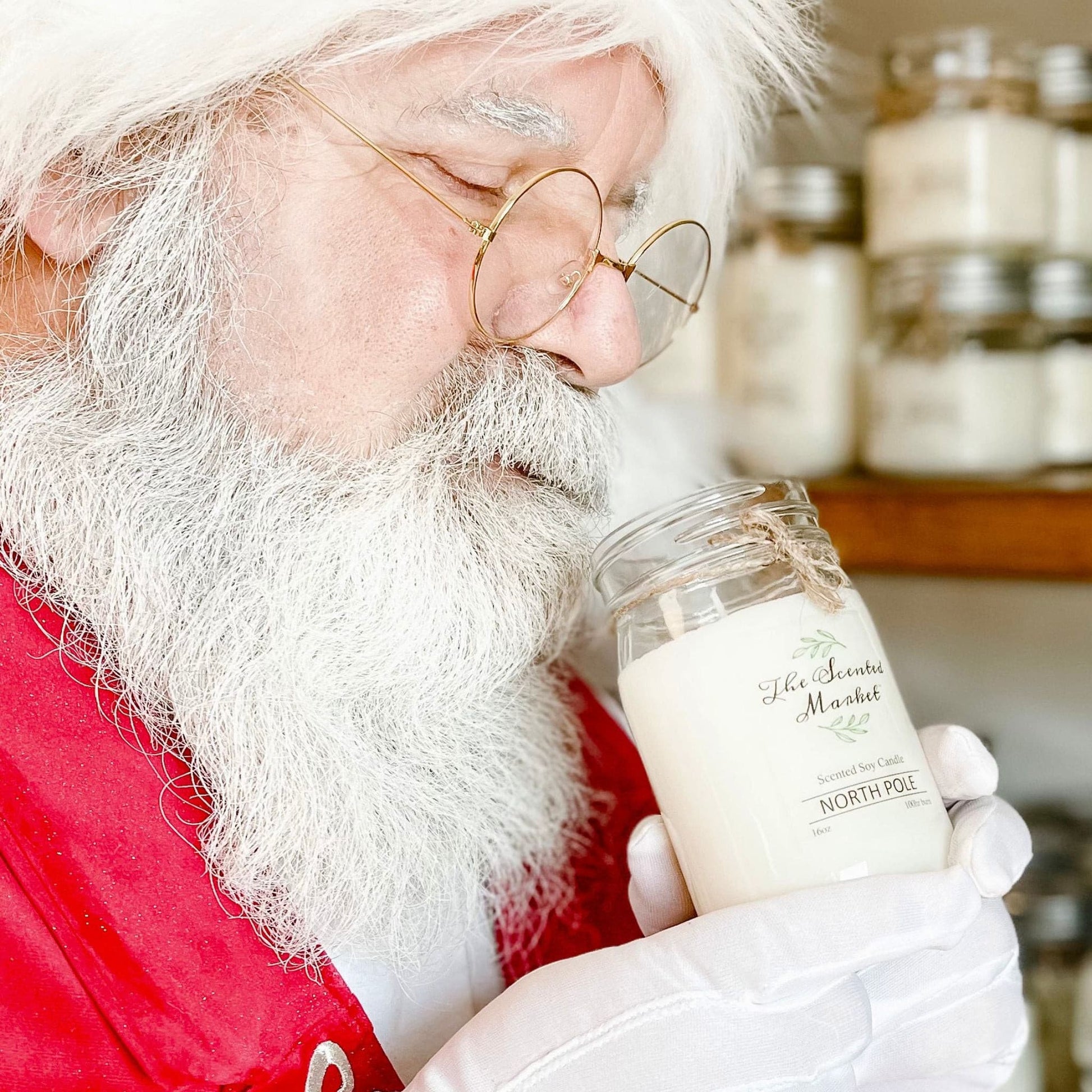 Santa smelling a North Pole Peppermint Scented Soy Wax Candle