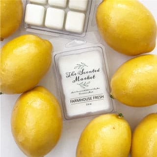 Farmhouse Fresh Scented Soy Wax Melt Surrounded by yellow lemons